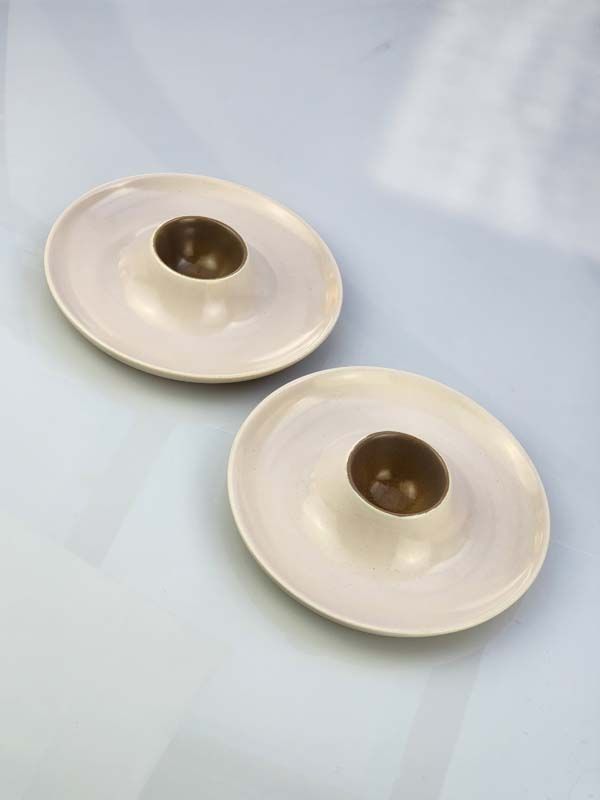 Pair of Poole Pottery combined egg cup &amp; plates