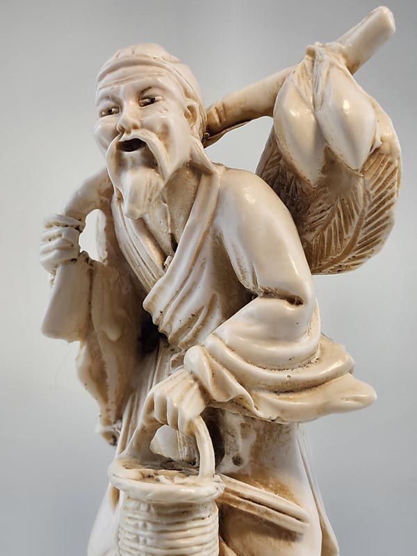 Chinese fisherman figurine.